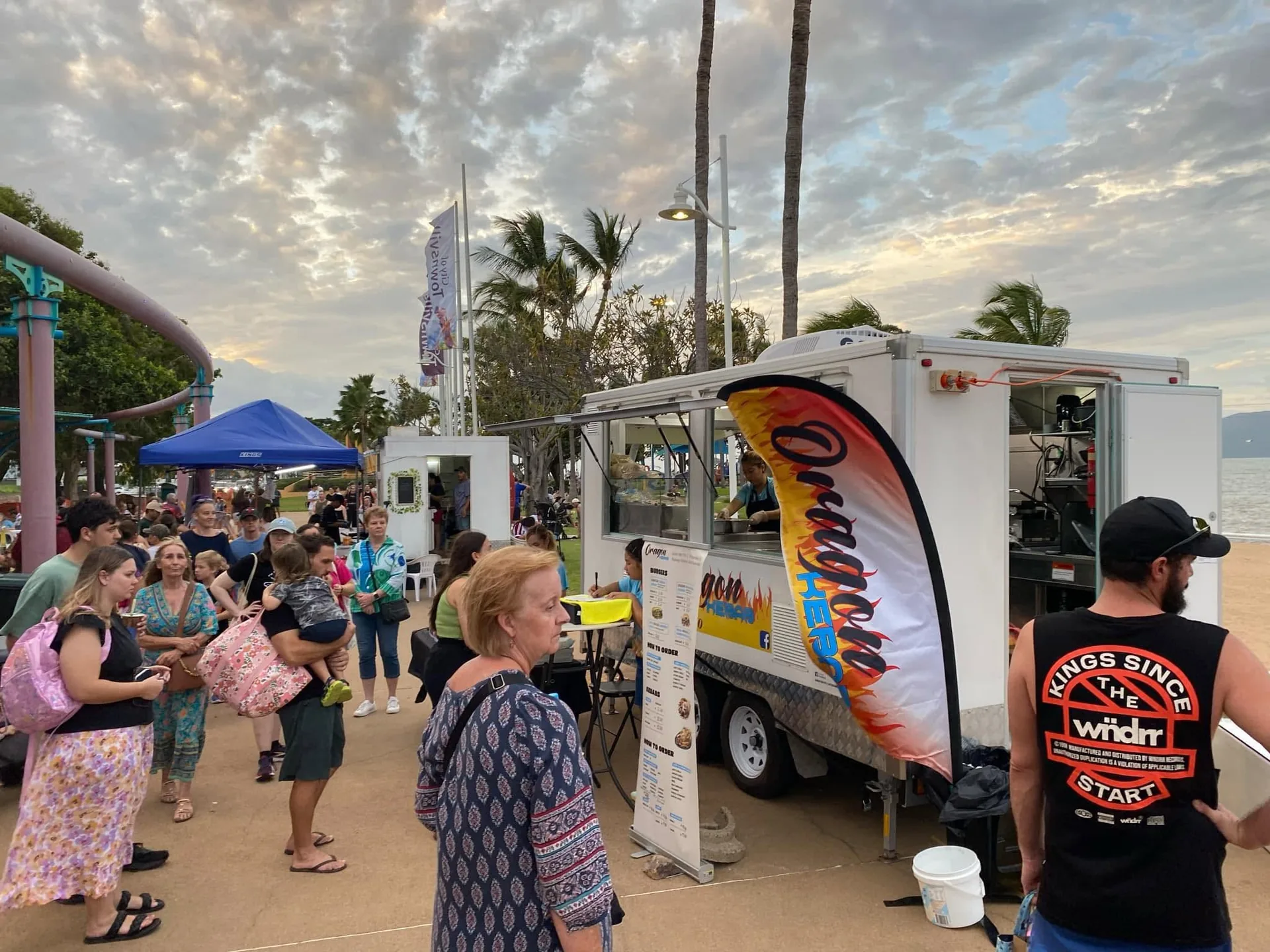 Oragon Kebab food truck serving customers at an outdoor waterfront event